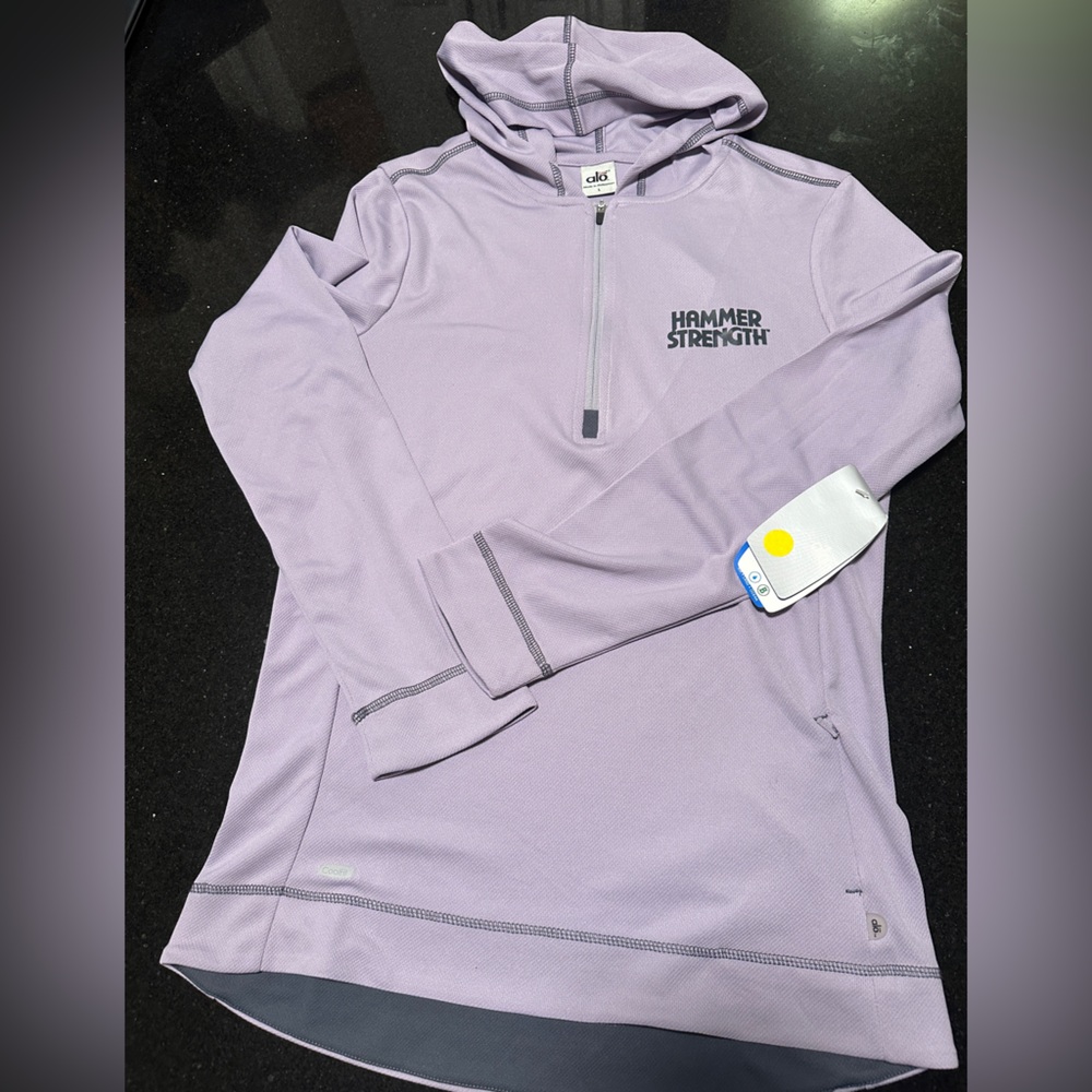Long sleeve exercise top. Hood, zipper pocket, zipper neck opening, great fit.